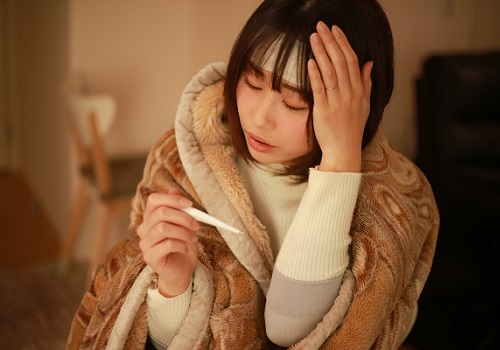 体調不良の女性